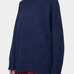 Woman wearing Atelier Delphine Vasilisa Turtleneck Sweater Navy three quarter view
