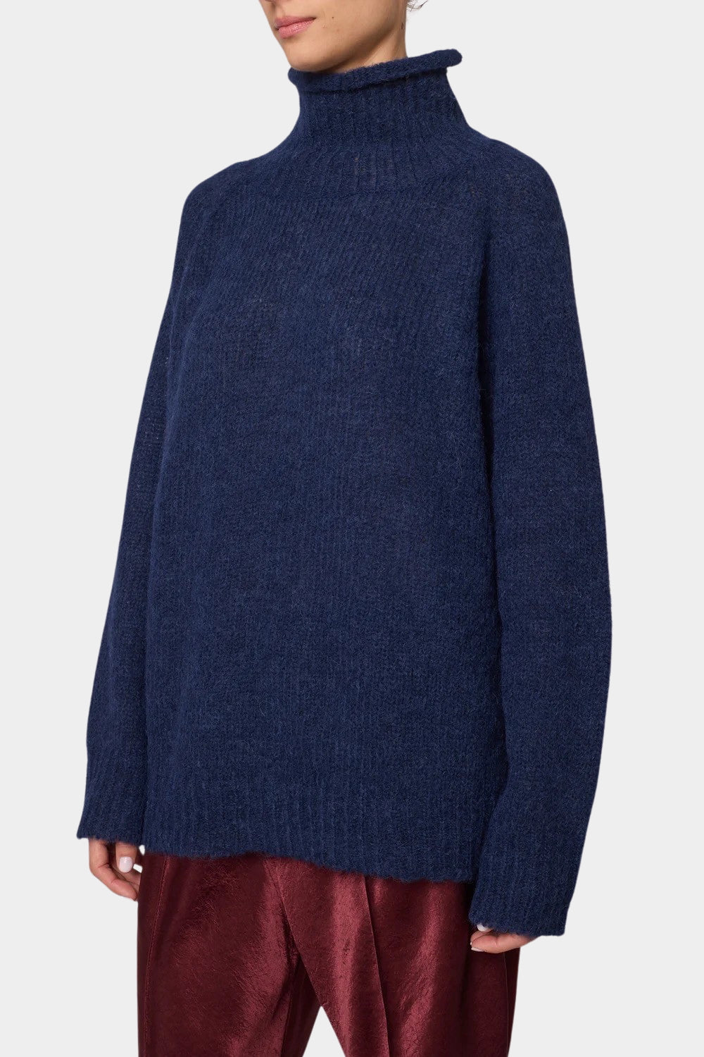 Woman wearing Atelier Delphine Vasilisa Turtleneck Sweater Navy three quarter view