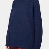 Woman wearing Atelier Delphine Vasilisa Turtleneck Sweater Navy three quarter view
