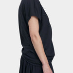 Black Crane asymmetric cotton gauze top sumi black angled side view showing drape and sleeve shape