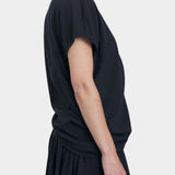 Black Crane asymmetric cotton gauze top sumi black angled side view showing drape and sleeve shape