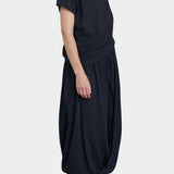 Black Crane asymmetric cotton gauze top sumi black side profile highlighting relaxed fit and lightweight texture