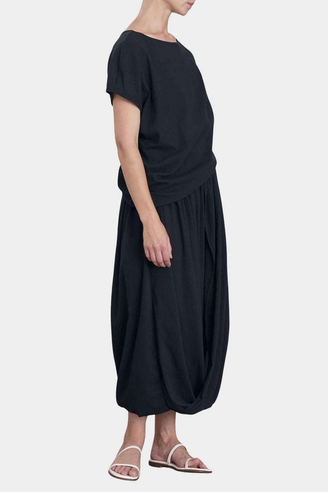 Black Crane asymmetric cotton gauze top sumi black side profile highlighting relaxed fit and lightweight texture
