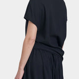 Black Crane asymmetric cotton gauze top sumi black back view showing soft drape and short sleeve silhouette