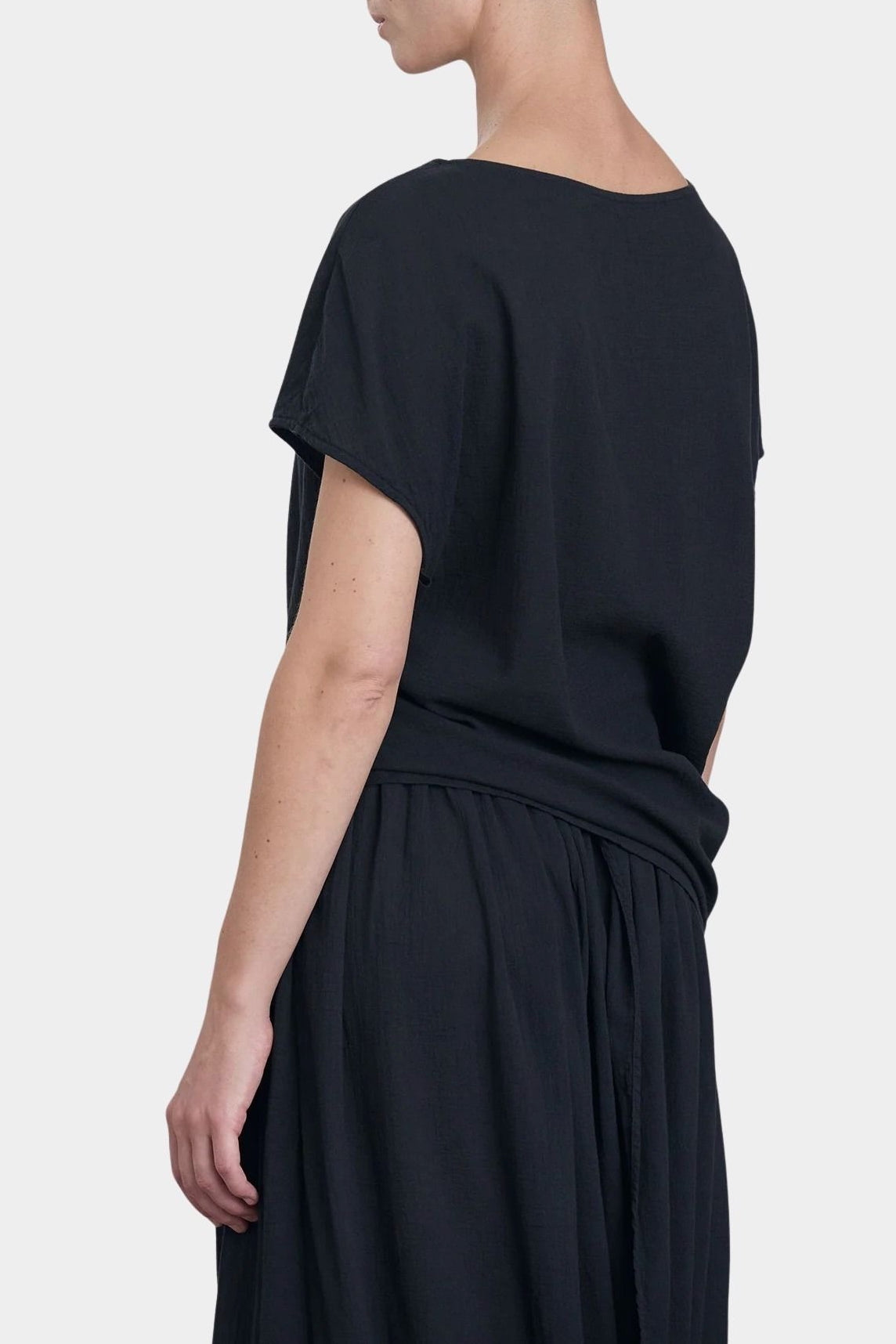 Black Crane asymmetric cotton gauze top sumi black back view showing soft drape and short sleeve silhouette