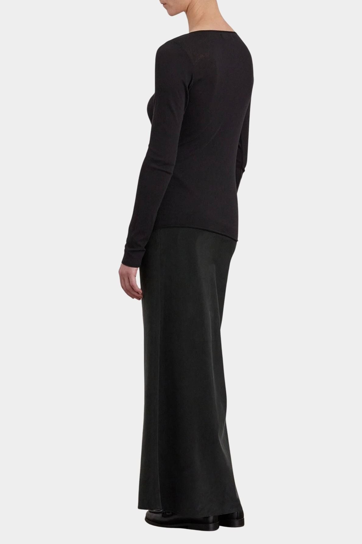 Black Crane Bias Skirt Black back three quarter view showing fluid full length drape