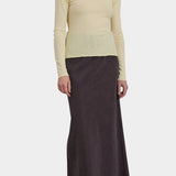 Black Crane Bias Skirt Dark Plum three quarter front view with fluid maxi length