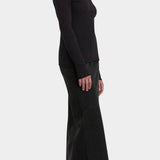 Black Crane Boat Neck Long Sleeve Black side view showing slim silhouette and raw edge hem