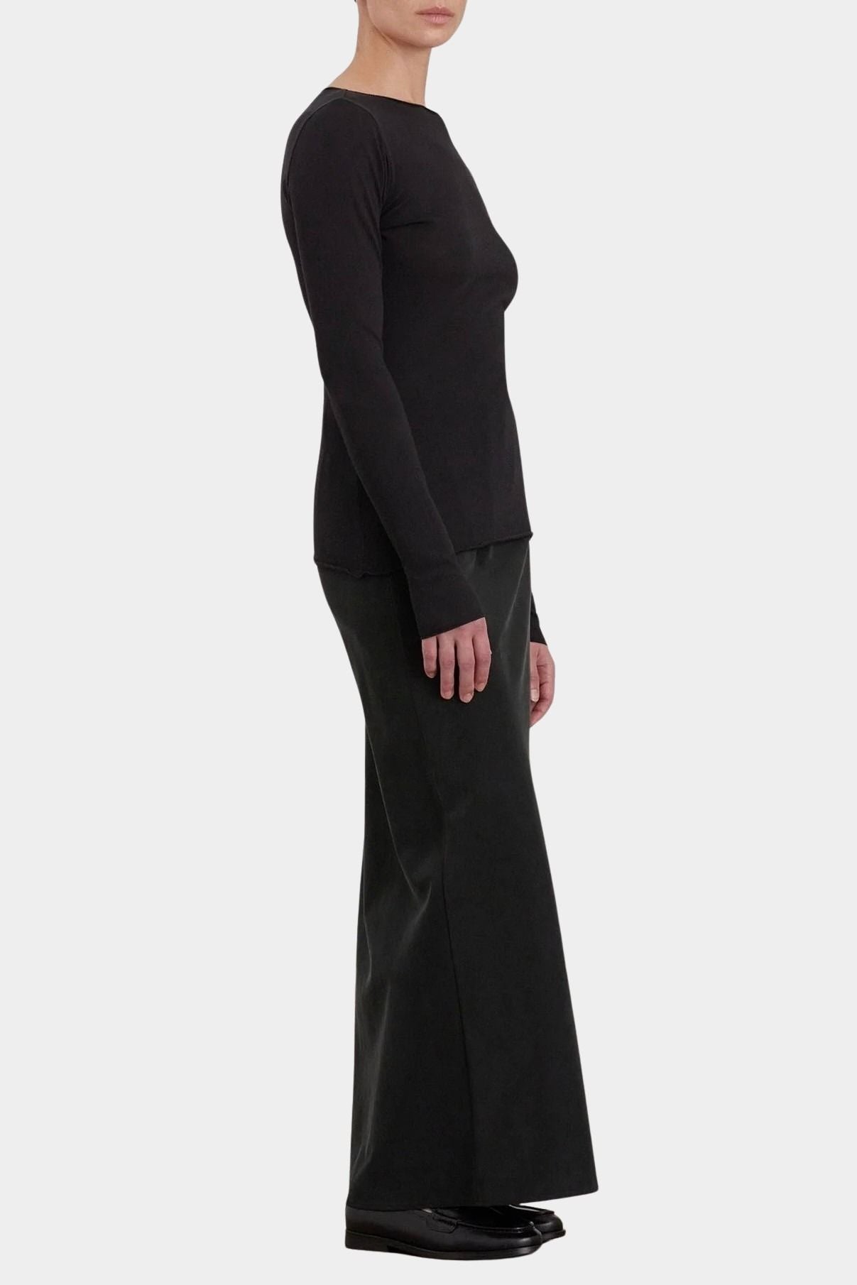 Black Crane Boat Neck Long Sleeve Black side view showing slim silhouette and raw edge hem