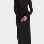 Black Crane Boat Neck Long Sleeve Black full front view styled with a long black skirt at YUCCA Denver
