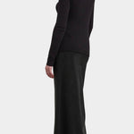 Black Crane Boat Neck Long Sleeve Black back three quarter view styled with a long black skirt