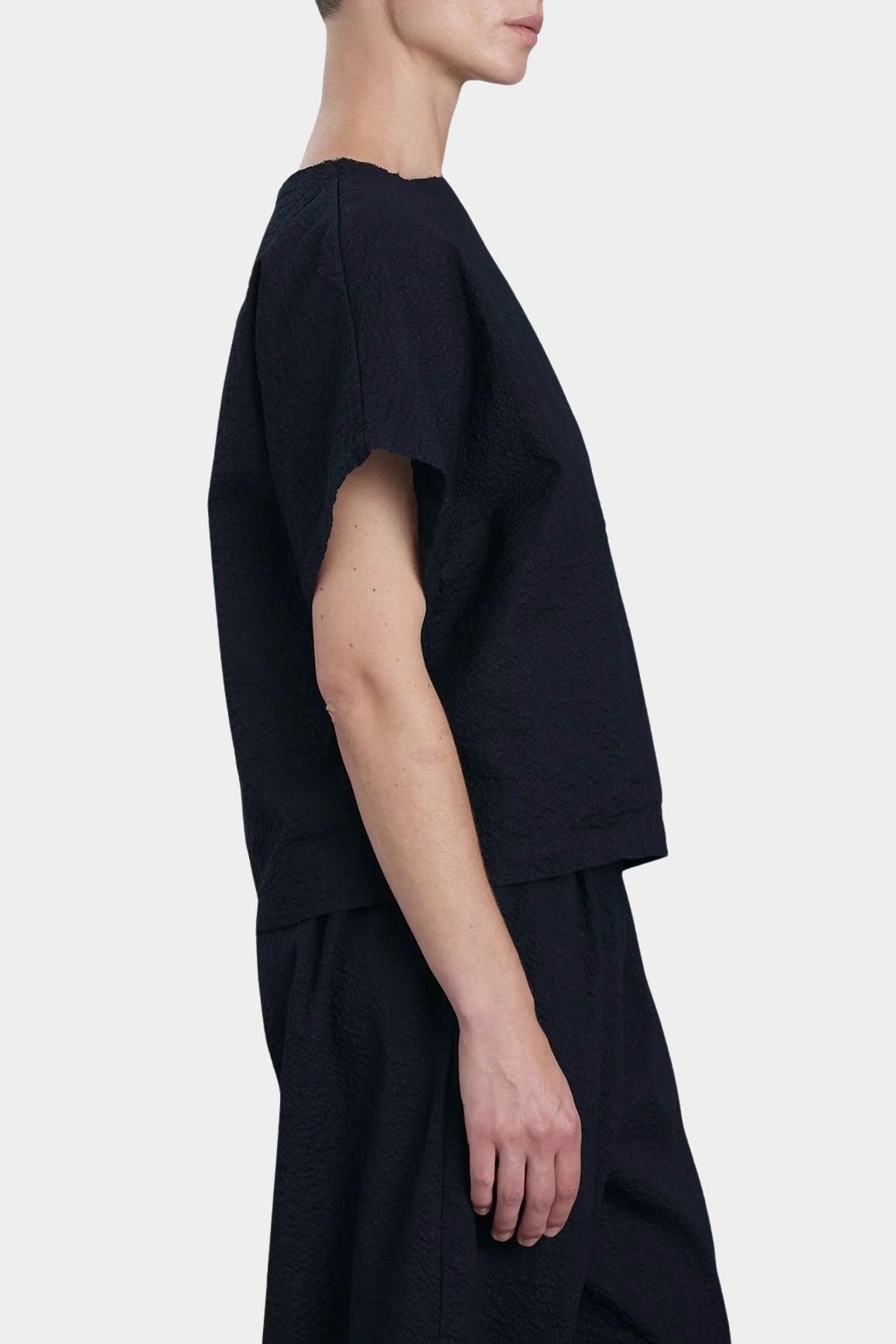 Black Crane boxed top midnight side view boxy fit short sleeve structured shape