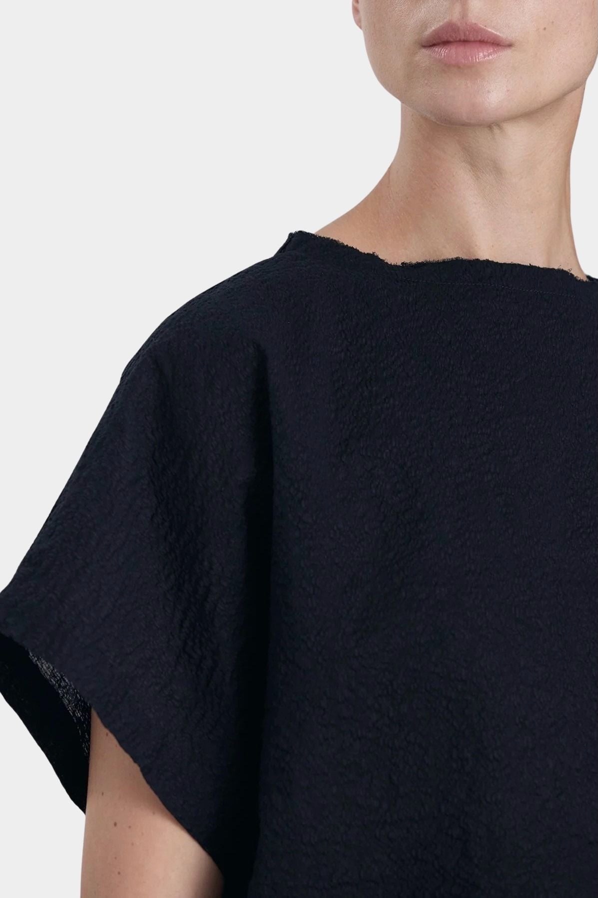 Black Crane boxed top midnight raw edge neckline detail textured cotton close up