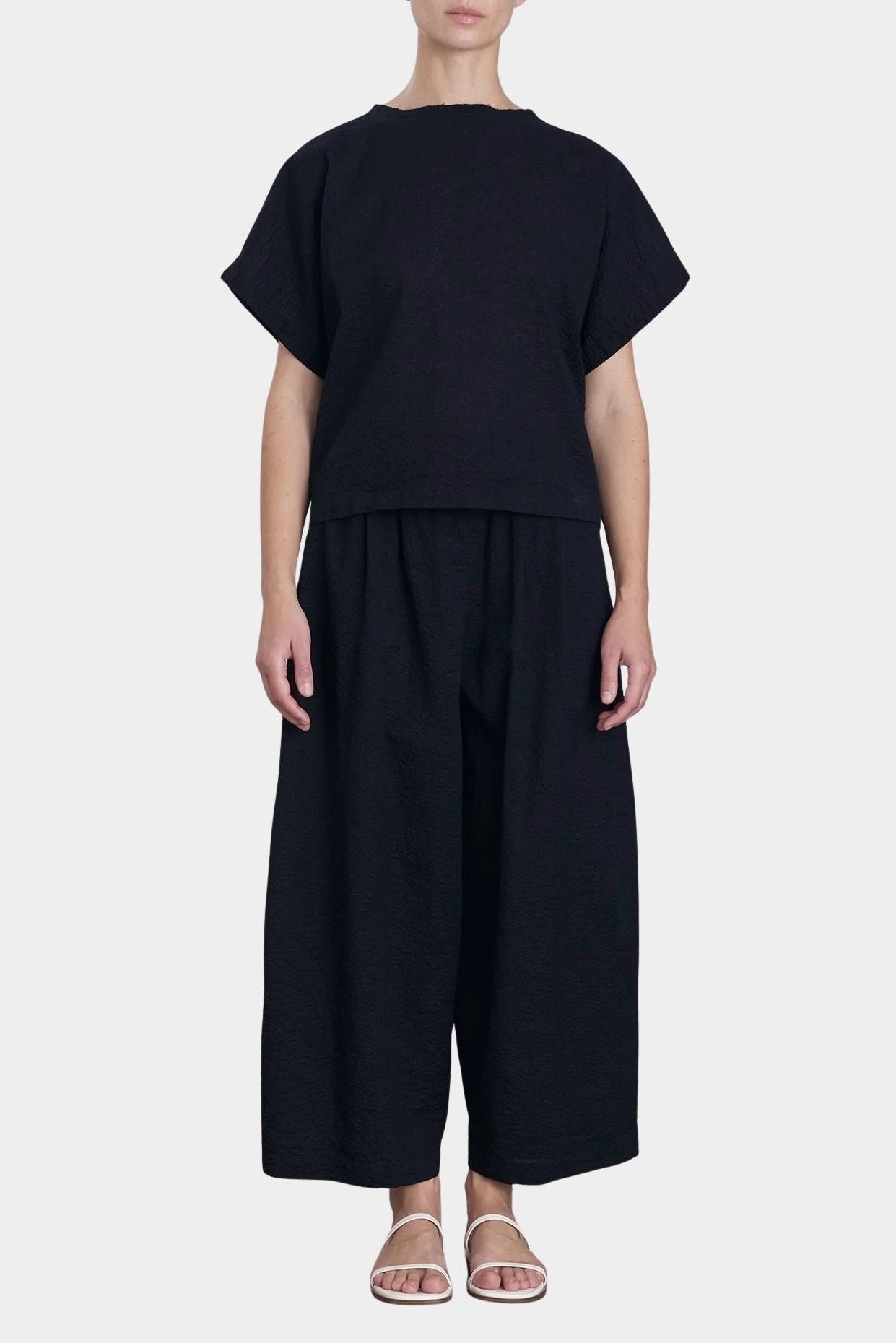 Black Crane boxed top midnight full body outfit relaxed fit modern uniform styling