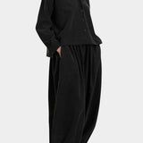 Black Crane Cropped Long Sleeve Black styled with matching pants, full length side view