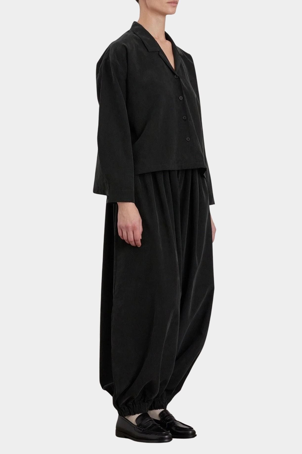 Black Crane Cropped Long Sleeve Black styled with matching pants, three quarter view at YUCCA Denver