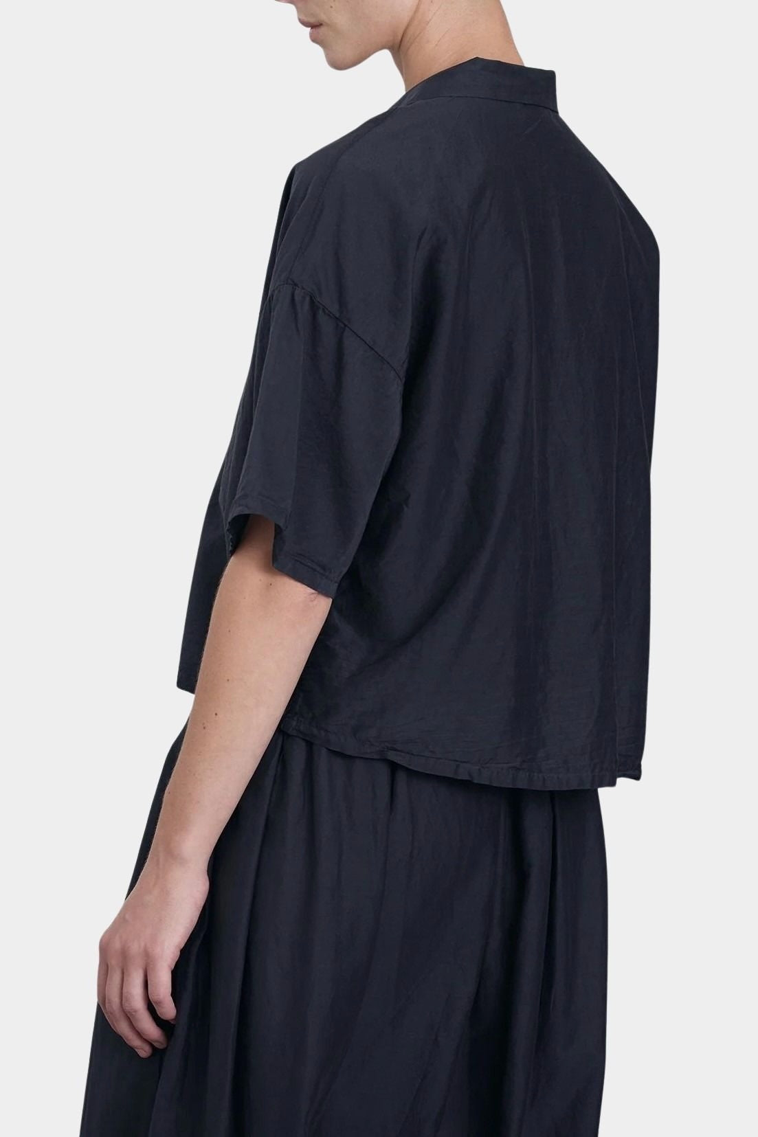 Black Crane cropped shirt faded black back detail showing clean lines and soft structure