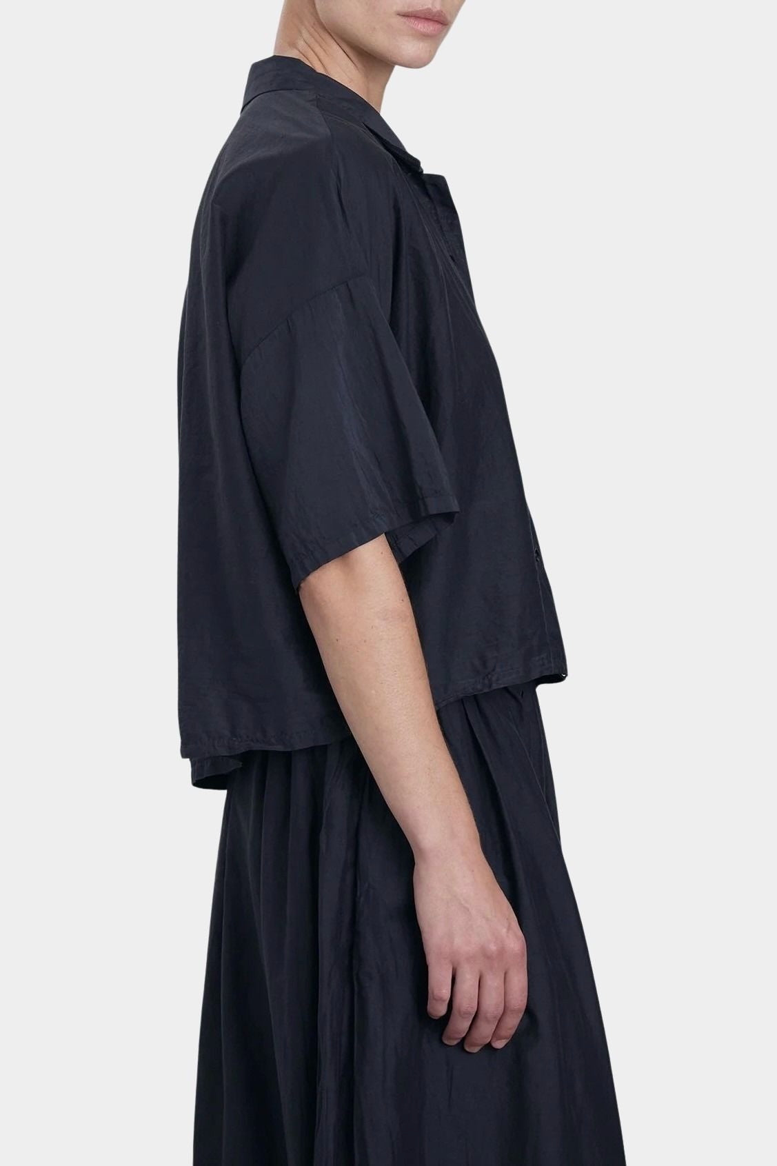 Black Crane faded black cropped button-up shirt side view with relaxed fit