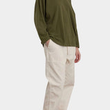 Black Crane Loose Fit Long Sleeve Army front three quarter view showing relaxed fit and dropped shoulders