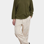 Black Crane Loose Fit Long Sleeve Army full front view styled with ivory pants at YUCCA Denver