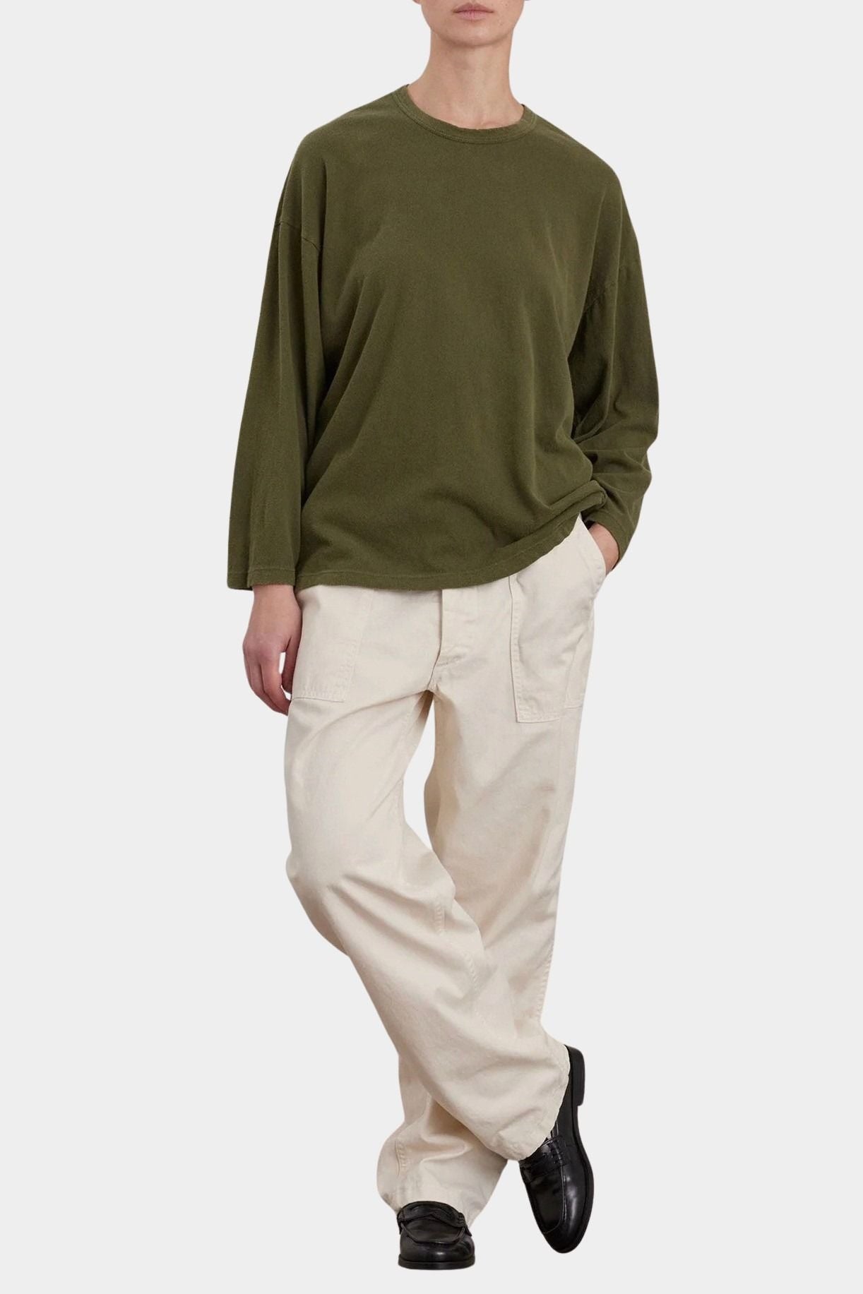 Black Crane Loose Fit Long Sleeve Army full front view styled with ivory pants at YUCCA Denver