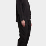 Black Crane Loose Fit Long Sleeve Black side view showing relaxed silhouette and dropped shoulders