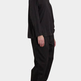 Black Crane Loose Fit Long Sleeve Black side view showing relaxed silhouette and dropped shoulders