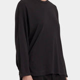 Black Crane Loose Fit Long Sleeve Black three quarter view showing relaxed drape and long sleeves