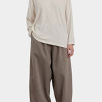 Black Crane Loose Fit Long Sleeve White full front view styled with wide leg pants at YUCCA Denver