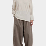 Black Crane Loose Fit Long Sleeve White full front view styled with wide leg pants at YUCCA Denver