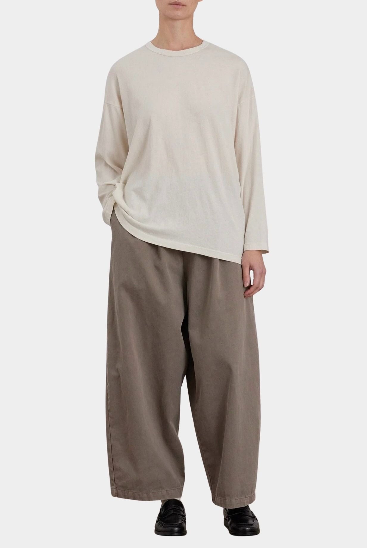 Black Crane Loose Fit Long Sleeve White full front view styled with wide leg pants at YUCCA Denver