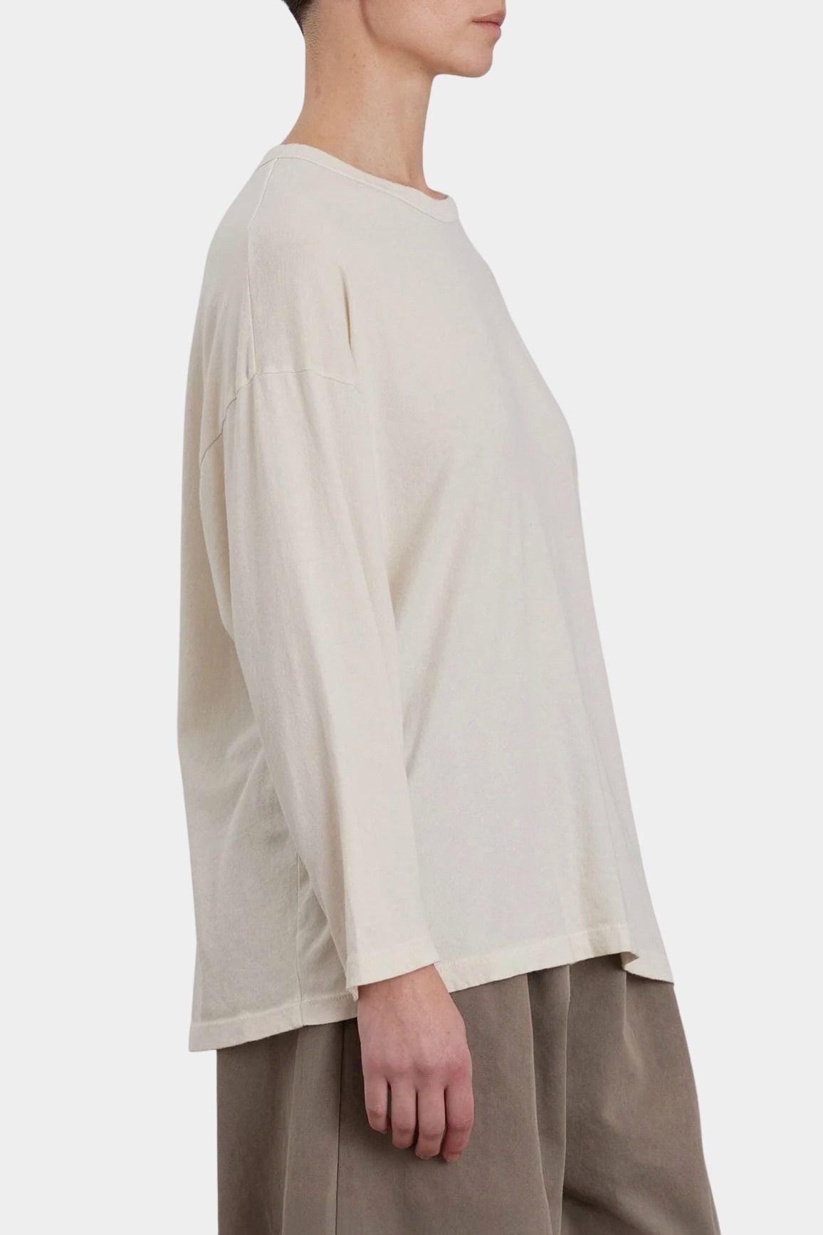 Black Crane Loose Fit Long Sleeve White side view showing roomy shape and long sleeves