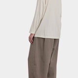 Black Crane Loose Fit Long Sleeve White back three quarter view showing oversized drape