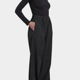 Black Crane Straight Pants Black side view showing relaxed fit, side pocket and draped straight leg