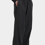 Black Crane Straight Pants Black three quarter view with elastic waist, side pockets and relaxed straight leg