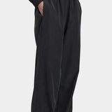 Black Crane Straight Pants Black three quarter view with elastic waist, side pockets and relaxed straight leg