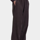 Black Crane Straight Pants Dark Plum side view showing elastic waist, side pocket and fluid straight leg