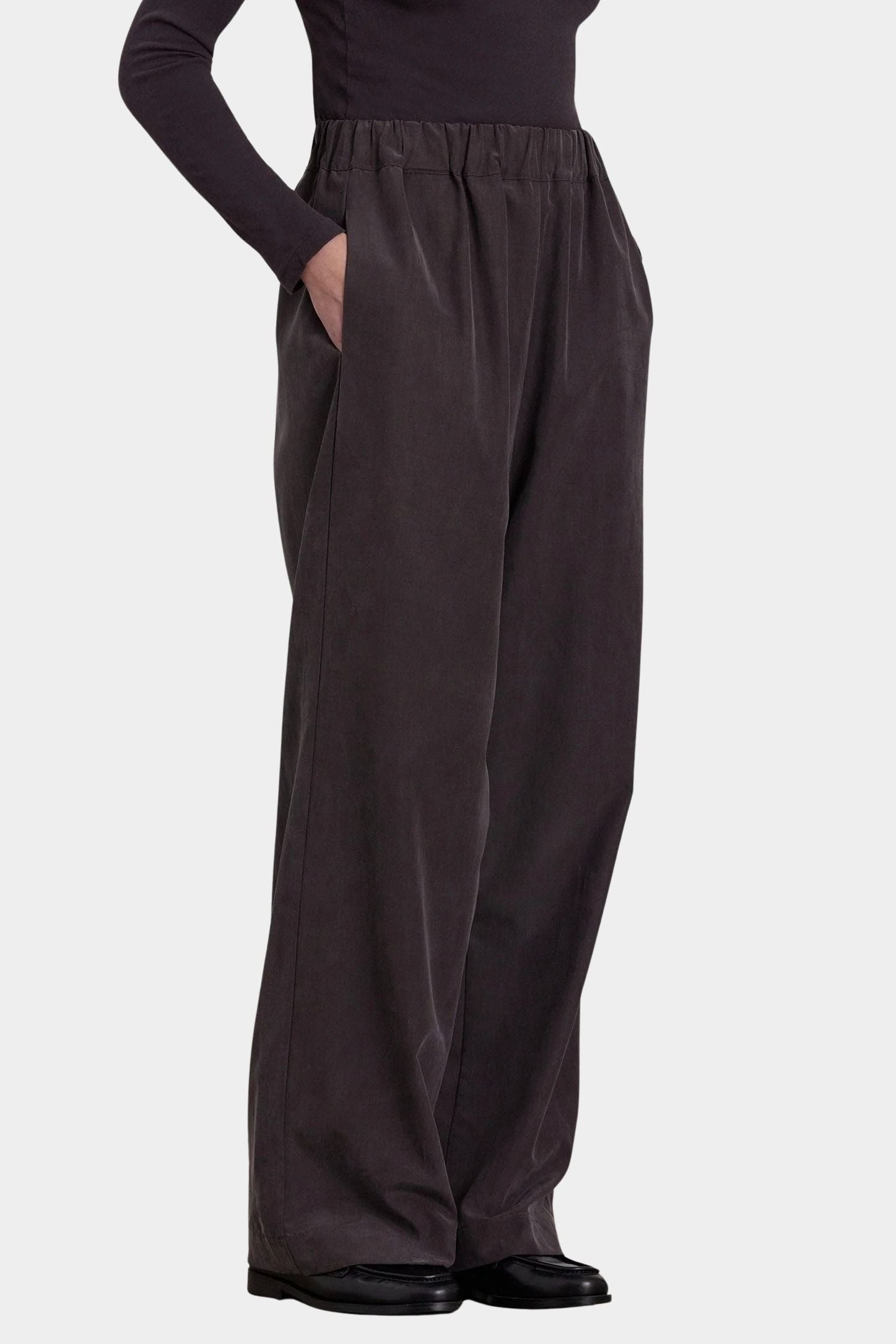 Black Crane Straight Pants Dark Plum side view showing elastic waist, side pocket and fluid straight leg