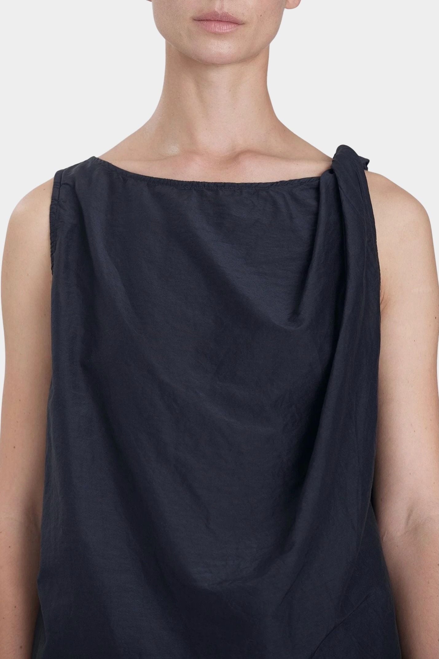 Black Crane twisted tank top faded black close-up of neckline and shoulder twist detail