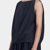 Black Crane faded black twisted tank top side view with asymmetric drape and relaxed silhouette