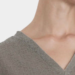 Black Crane v neck dress p grey neckline detail raw edge v neck cotton close up