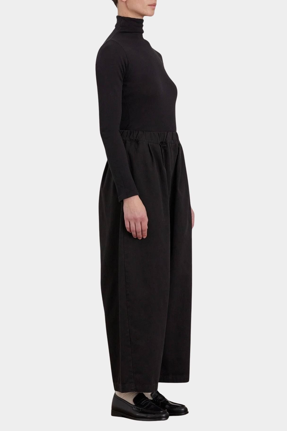Black Crane Wide Pants Black side view showing full cropped leg and relaxed drape