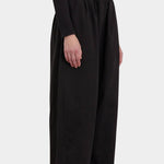 Black Crane Wide Pants Black side view showing relaxed volume and ankle length