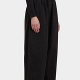 Black Crane Wide Pants Black side view showing relaxed volume and ankle length