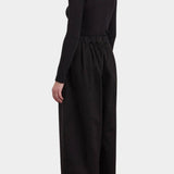 Black Crane Wide Pants Black back view with elastic waist and cropped wide leg