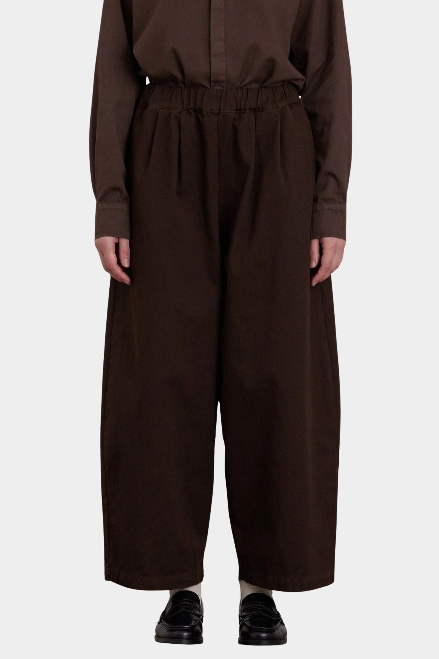 Black Crane Wide Pants Dk. Cacao front view with elastic waistband and softly pleated wide leg