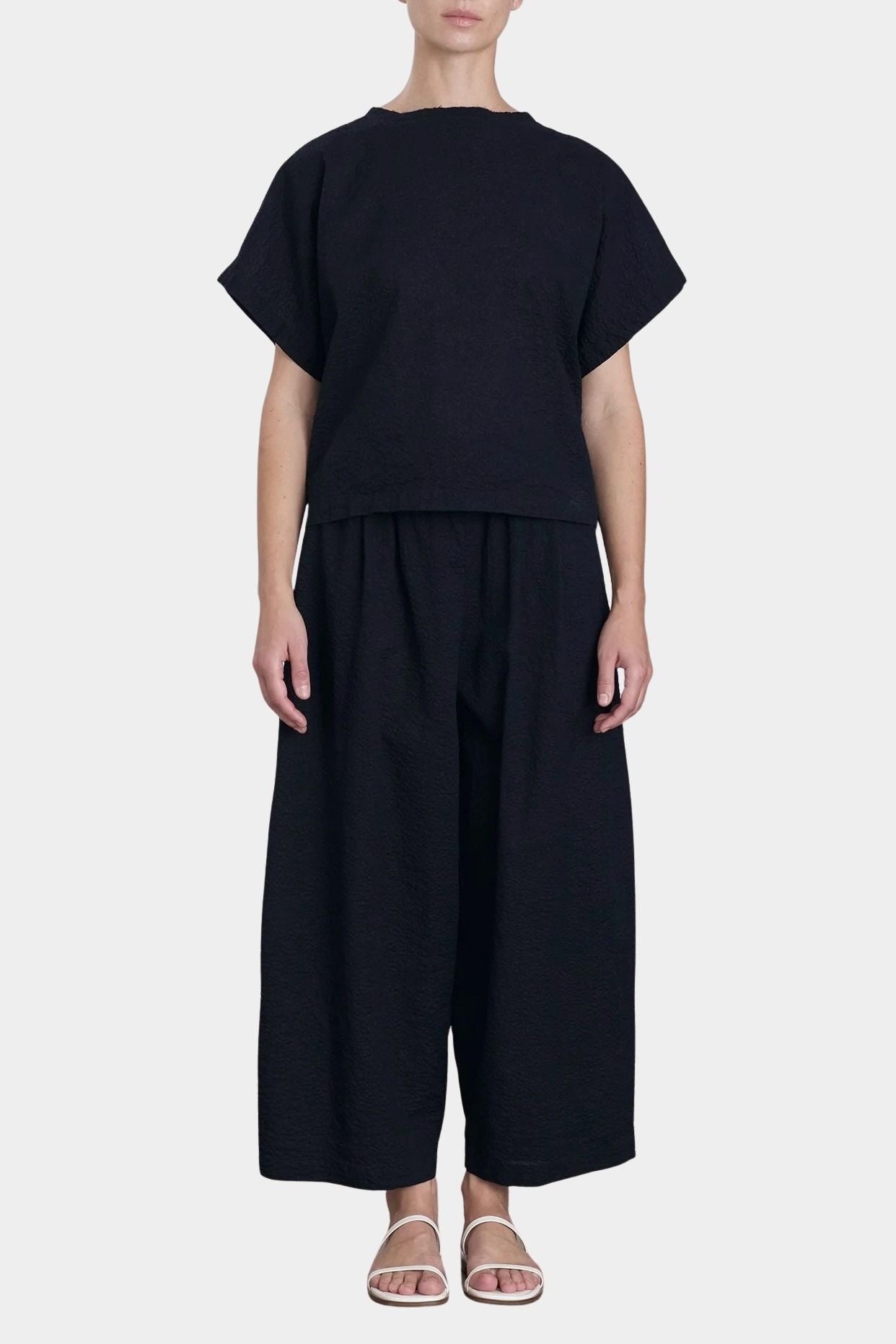 Black Crane wide pants midnight side profile cropped length relaxed structure