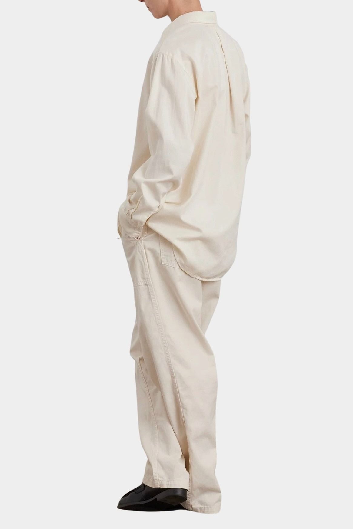 Black Crane Work Shirt Natural full side view showing oversized silhouette and curved shirttail hem