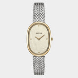 .
Front view of BREDA Jane Tethered watch with champagne mother of pearl dial and two tone metal desig