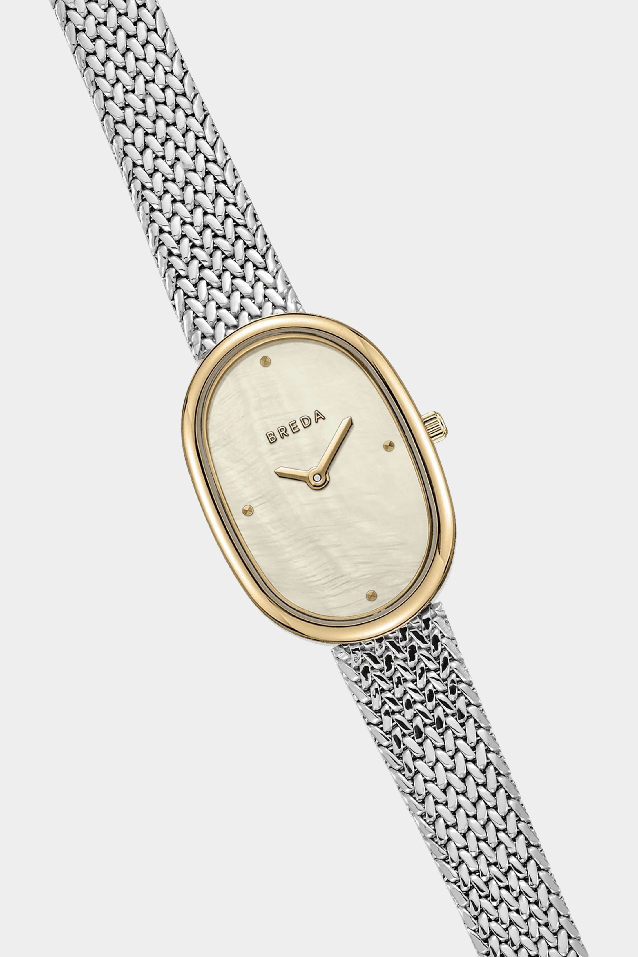 BREDA Jane Tethered watch with gold oval case, mother of pearl dial and woven silver bracelet at YUCCA Denver